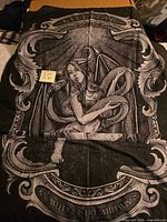 Full view of large Killstar tapestry showing top banner and graphic