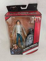 Front of sealed DC Comics Multiverse Lex Luthor figure showing figure, accessory, sticker residue on window