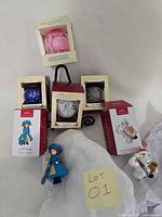 Group shot showing all five boxed Hallmark Keepsake ornaments with two loose character ornaments