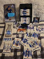 Overview of tin, banner, die-cut cards, sealed packs