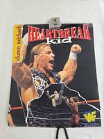 Front view of entire poster showing wrestler image and title