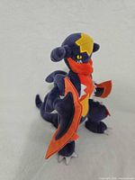 Full left-side view of Garchomp plush standing
