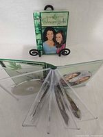Front view of sealed Gilmore Girls Season 4 DVD box set on stand