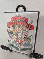 Front of sealed WWE Ring in the Holiday DVD showing artwork and shrink wrap