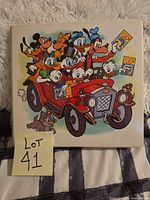 Front of binder showing Disney characters in red car