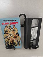 Front view of VHS cassette and illustrated sleeve