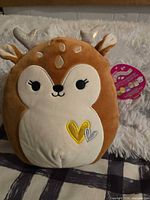 Front view of Dawn the Fawn Squishmallow showing tag and details