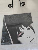 Front cover of sealed LP showing artwork and intact shrink wrap