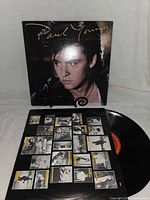 Front cover of Paul Young album on stand with vinyl record and picture inner sleeve displayed
