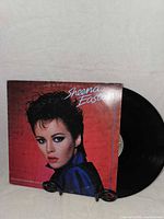 Front sleeve and vinyl partially removed showing artist and album title