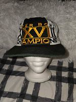 Front view showing embroidered Super Bowl XXVII Champions text and gold roman numerals