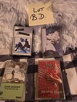 All four cassette tapes with cover art visible