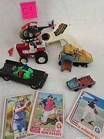 Group view of all toys and three baseball cards