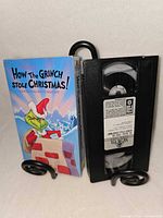Front view of VHS cassette and illustrated slipcase