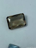 Top view of rectangular emerald-cut smokey topaz
