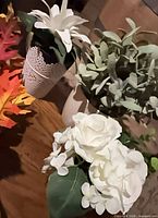 Close-up of white daisy plant, eucalyptus plant and rose-hydrangea plant