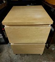 Front view of IKEA Malm birch 2-drawer nightstand