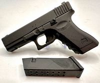 Left side view of miniature Glock-style pistol showing overall form and molded details