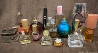 Group shot of all perfume bottles showing quantity and variety