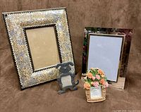 Front view of all four frames standing on surface