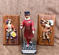 Front view showing both wall plaques and Yeoman Warder figurine