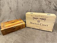 Front view of both wooden boxes showing sizes, latch on decorative box, printed branding on wine crate