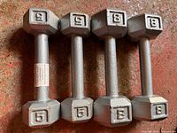 Five hex dumbbells showing weight numbers