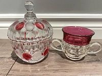 Candy jar with lid and sugar bowl side by side