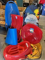 Group shot of all sleds and boards