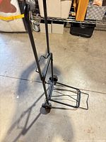 Hand truck unfolded showing frame, wheels and platform