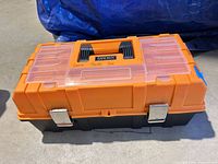 Closed tackle box showing brand label, colour and latches