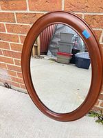 Front view showing wood frame color and mirror glass