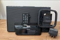 Front view of docking speaker with accessories