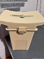 Front view of Tridon plastic seat/cooler showing latch and branding