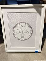 Front view showing quote, frame, and matting