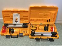 Both laser level kits opened showing contents
