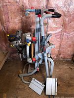 Side view of Mastercraft miter saw folded onto Bosch stand