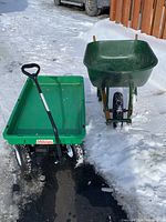 Top view of green Millside utility wagon and green plastic wheelbarrow side by side showing tires, handles and frames