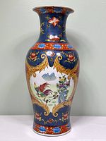 Full view of porcelain vase with rooster and floral motifs