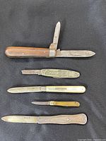 All five knives arranged showing handles and blades