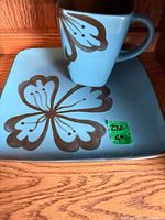 mug and saucer showing color and pattern