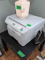 Overall view of Brother DCP-7030 printer showing exterior, control panel and power cord