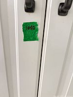 Cabinet door with lot number tape