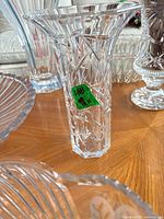 Full view of vase showing geometric cut pattern and flared rim