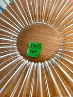 Top view of clear fluted glass bowl with green tape showing 14"