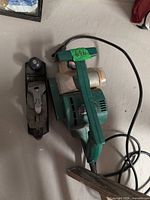 Top view of Craftsman electric planer and metal hand plane showing overall condition