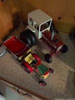 International Farmall tractor, tin tractor and trailer overview