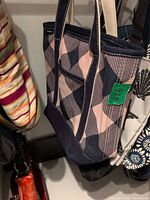 Side view of Lands' End navy and pink patterned canvas tote hanging, showing exterior pocket and handles