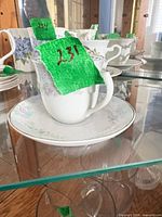 side view of teacup on saucer showing pattern