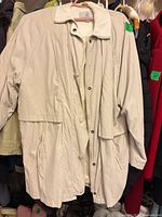 Front view of light beige London Fog women's jacket on hanger